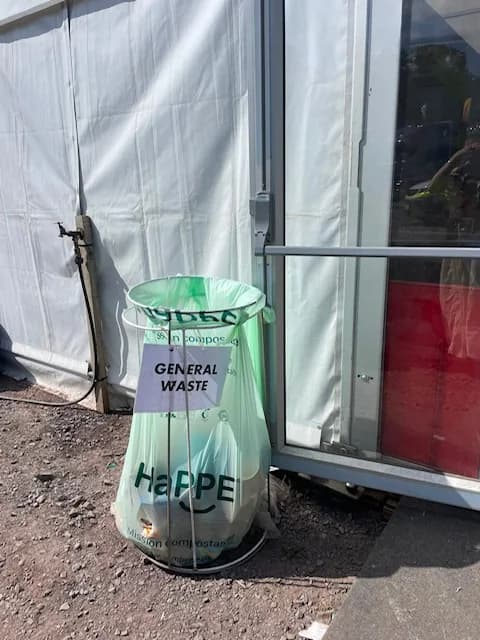 A HaPPE compostable sack lining a general waste bin at an outdoor event